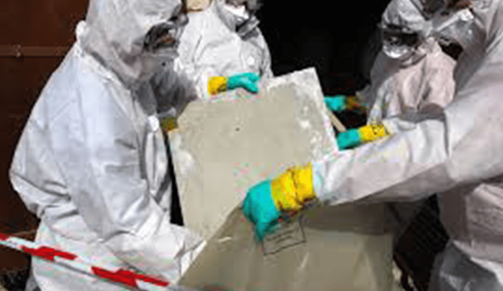 Hazmat techs removing dangerous chemicals