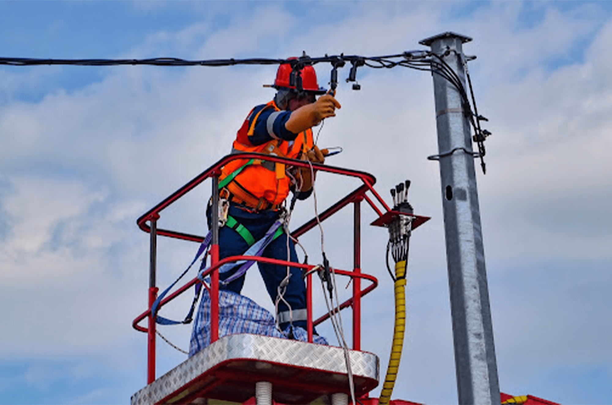 Worker repairing power lines
