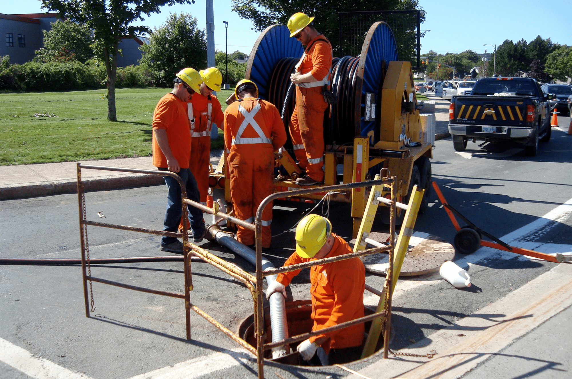 workers fixing sewer