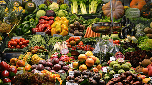 fruit and vegetable stand in supermarket