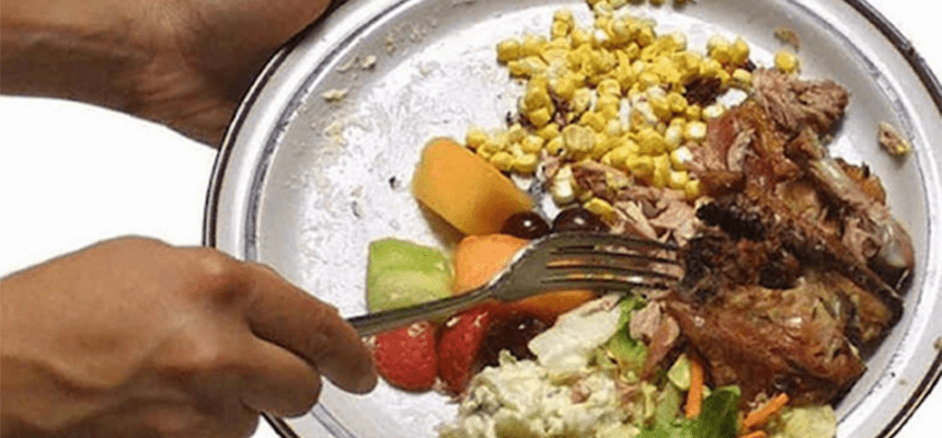wasted food being scraped off plate