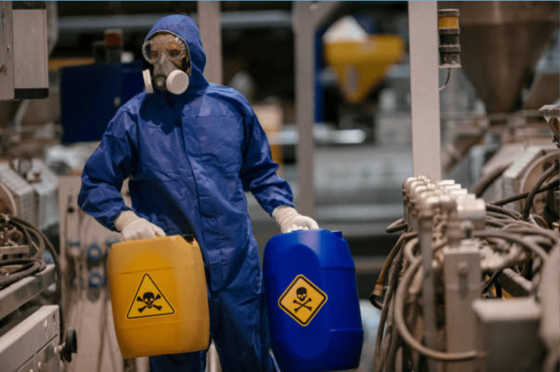 Worker In Laboratory Transporting Chemicals