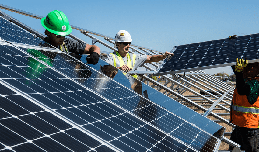 Engineers setting up solar panels